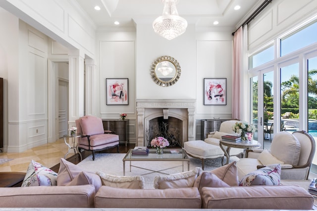 living room featuring crown molding, a high ceiling, and a notable chandelier