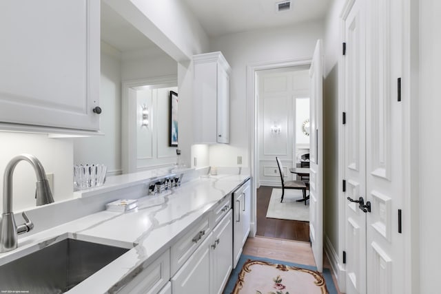 bathroom with wood-type flooring and vanity