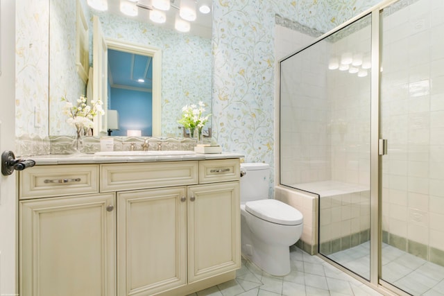 bathroom featuring toilet, tile floors, a shower with shower door, ornamental molding, and vanity