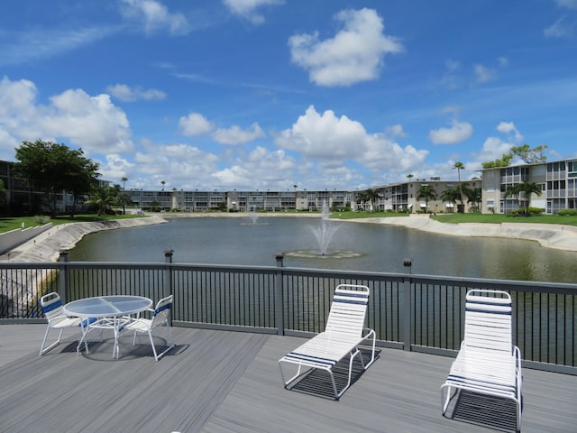 wooden deck featuring a water view