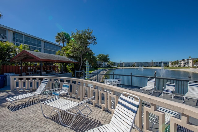 wooden terrace with a water view