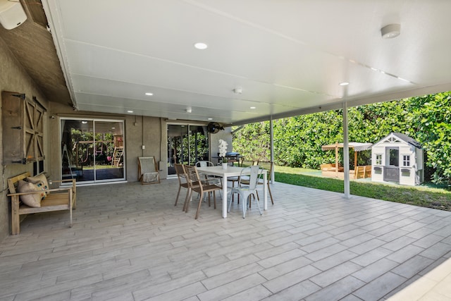 view of terrace with an outdoor structure