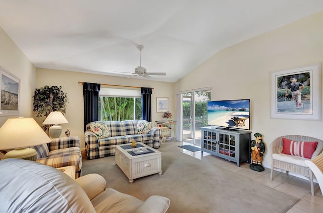 living room featuring ceiling fan, vaulted ceiling, and light tile flooring