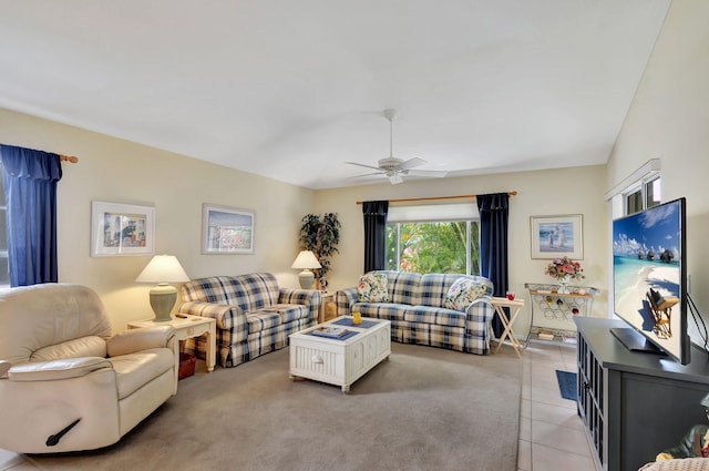 carpeted living room with ceiling fan