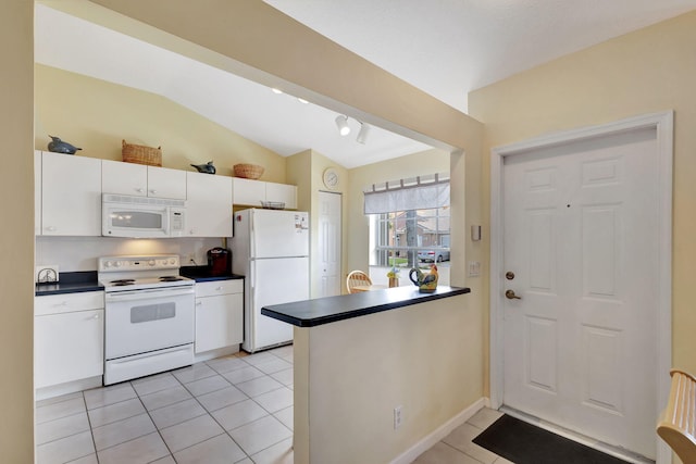 kitchen featuring kitchen peninsula, white appliances, lofted ceiling, white cabinetry, and light tile floors