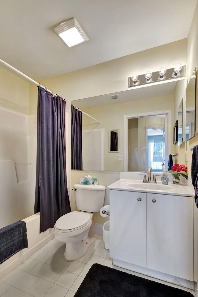 full bathroom featuring tile floors, vanity, toilet, and shower / tub combo with curtain