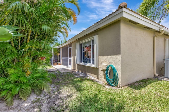 view of property exterior with a yard