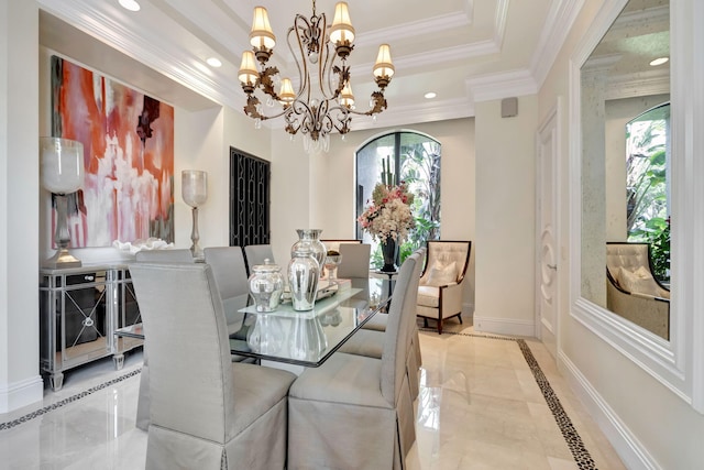 dining room with light tile flooring, a raised ceiling, a chandelier, and crown molding