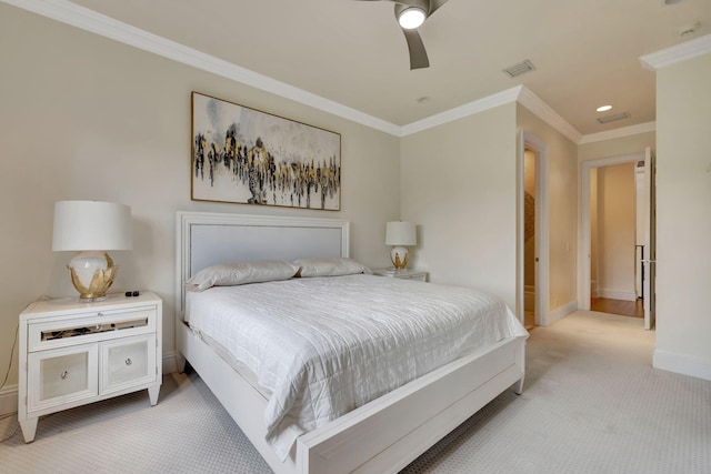 carpeted bedroom featuring ornamental molding and ceiling fan