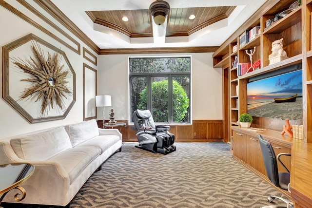 living area featuring ornamental molding, carpet floors, wooden ceiling, and a tray ceiling