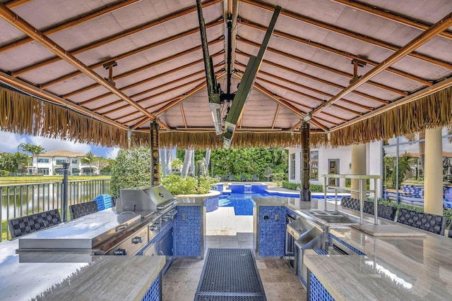 view of swimming pool featuring a patio, area for grilling, and a gazebo