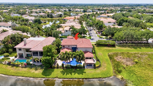 birds eye view of property with a water view