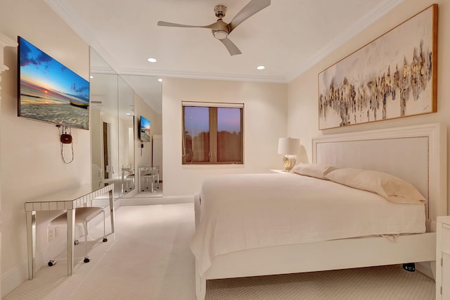 carpeted bedroom featuring crown molding and ceiling fan