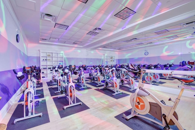 exercise room with a drop ceiling