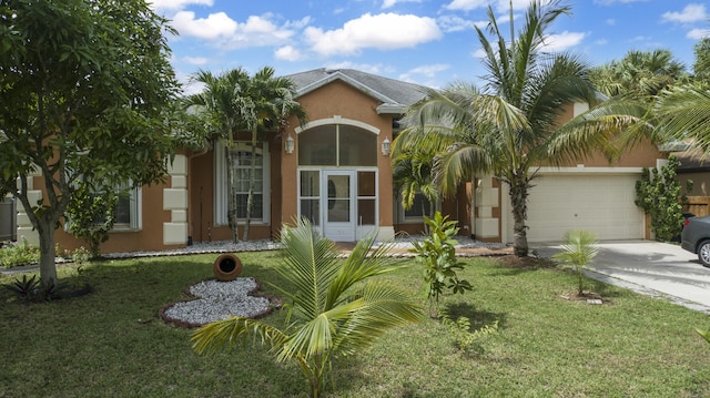 view of front of home featuring a garage and a front yard