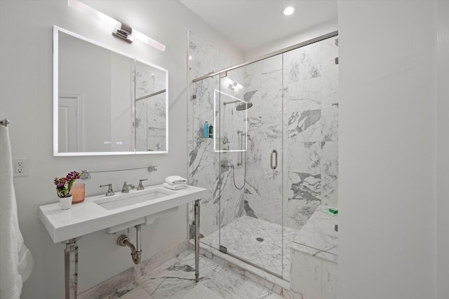 bathroom featuring walk in shower, sink, and tile floors