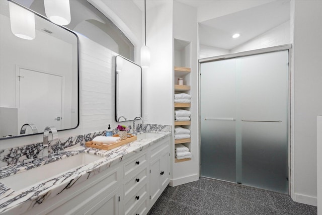 bathroom featuring double vanity, tile flooring, and lofted ceiling