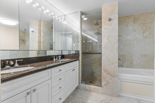 bathroom featuring vanity and a shower with door