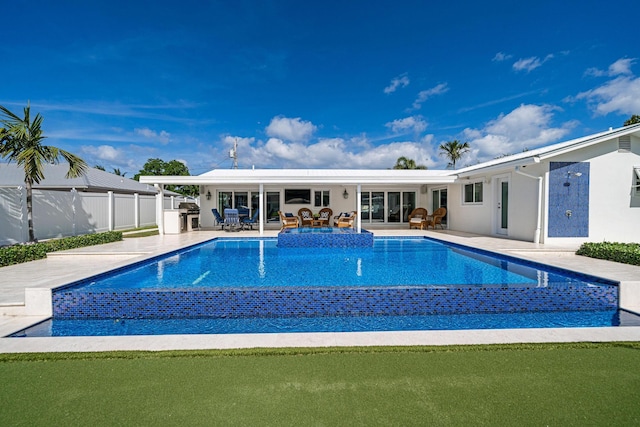 view of pool with a patio and grilling area