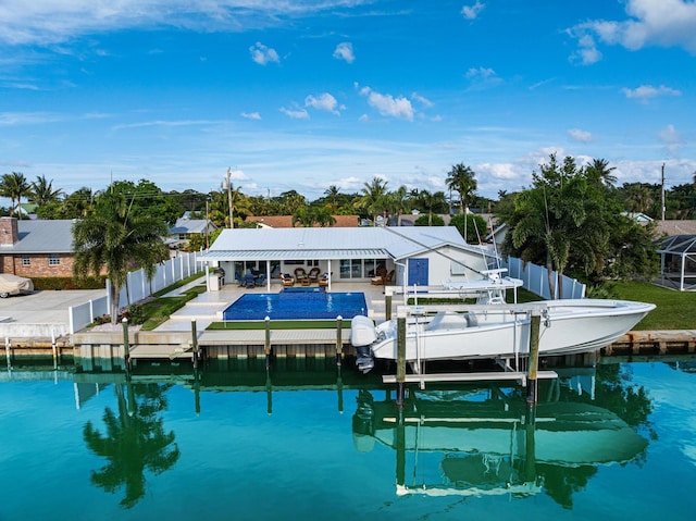 back of house with a water view