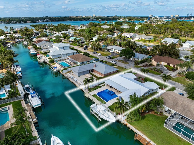 birds eye view of property featuring a water view