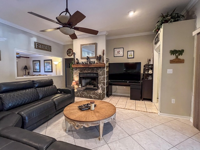 tiled living room featuring a fireplace, ceiling fan, and crown molding