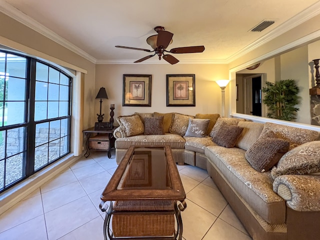 living room with ceiling fan, crown molding, and light tile floors