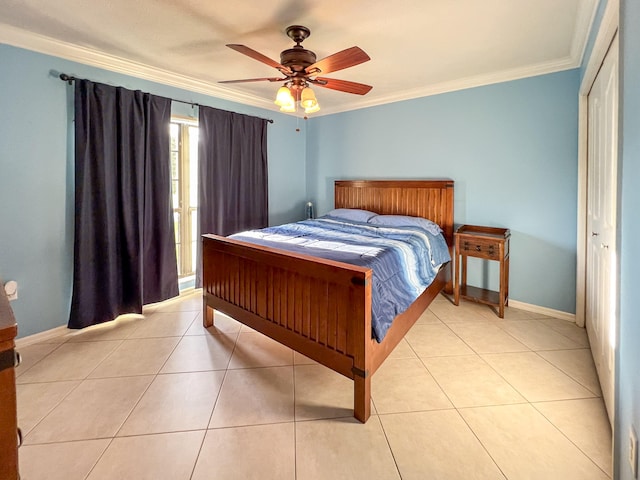 tiled bedroom featuring ornamental molding, a closet, and ceiling fan