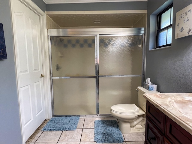 bathroom featuring walk in shower, toilet, tile floors, and vanity