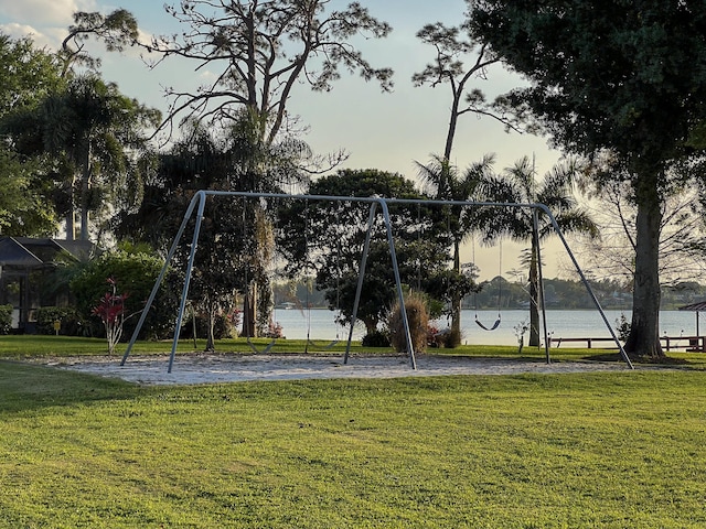 exterior space featuring a water view and a lawn