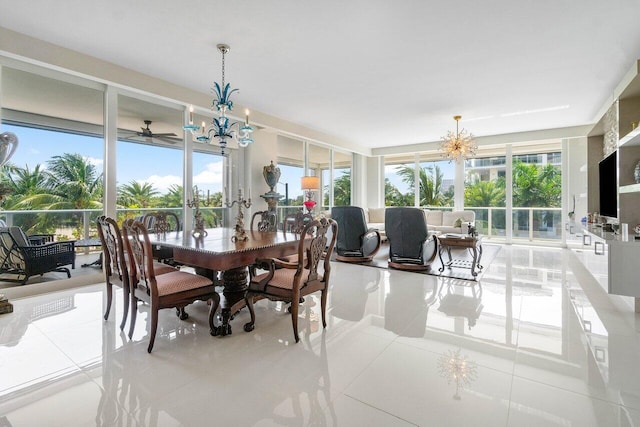 dining area with light tile floors and ceiling fan with notable chandelier