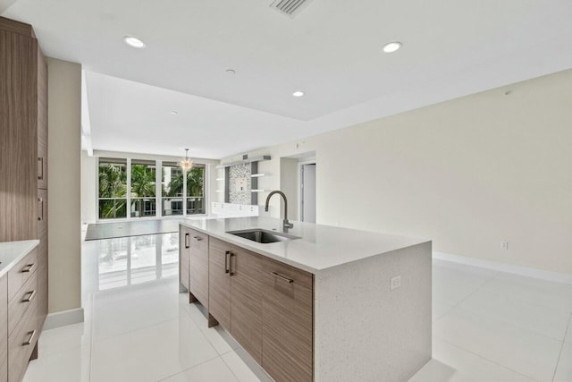 2720 Donald Ross Rd Unit 301, Palm Beach Gardens, FL 33410 - kitchen with an island with sink, modern cabinets, visible vents, light countertops, and a sink