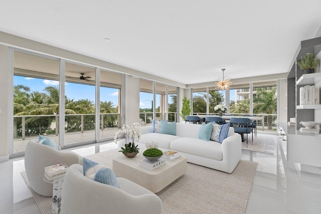 2720 Donald Ross Rd Unit 301, Palm Beach Gardens, FL 33410 - living room featuring a chandelier and a wall of windows