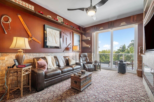 carpeted living room featuring ceiling fan