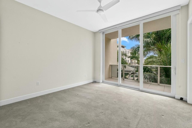2720 Donald Ross Rd Unit 301, Palm Beach Gardens, FL 33410 - spare room with carpet flooring, floor to ceiling windows, a ceiling fan, and baseboards