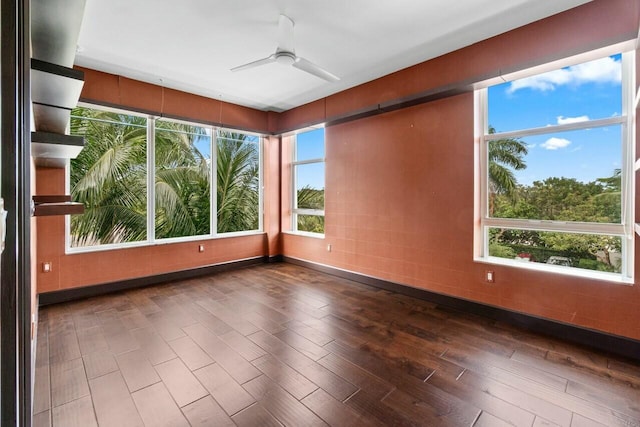 2720 Donald Ross Rd Unit 301, Palm Beach Gardens, FL 33410 - empty room with wood finished floors, ceiling fan, baseboards, and plenty of natural light
