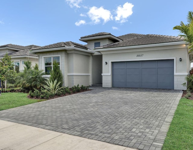 prairie-style home with a garage