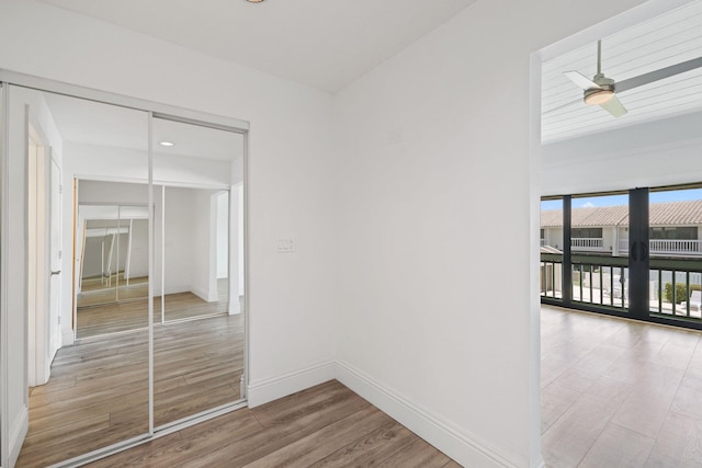 interior space featuring ceiling fan and light wood-type flooring