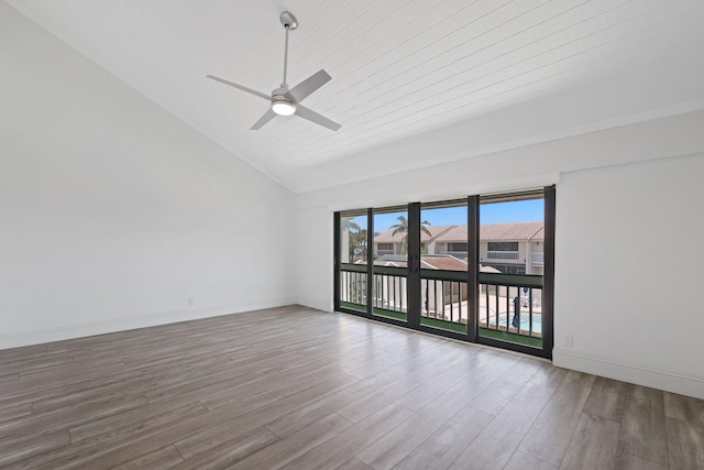 spare room with high vaulted ceiling, wood-type flooring, and ceiling fan