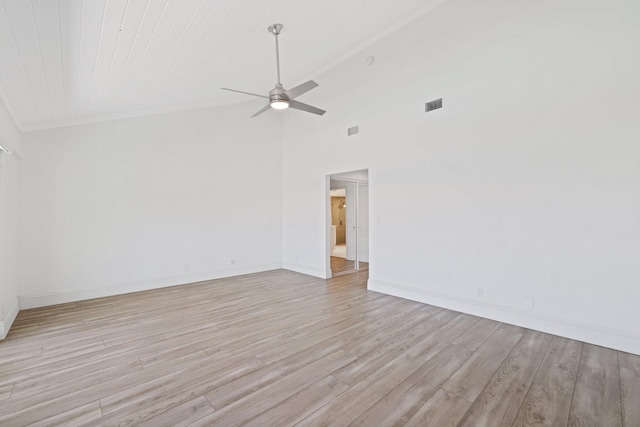 spare room featuring ceiling fan, high vaulted ceiling, and light wood-type flooring