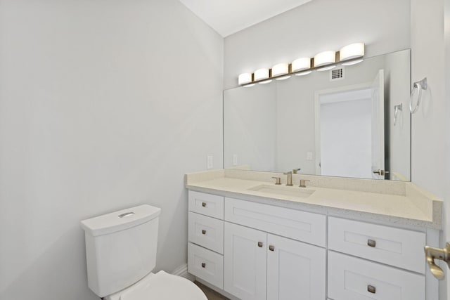 bathroom with oversized vanity and toilet