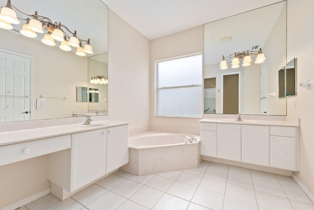 full bath featuring a sink, two vanities, a garden tub, and tile patterned flooring