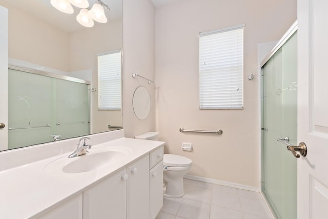 full bathroom with toilet, a shower stall, vanity, tile patterned flooring, and baseboards