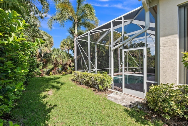 view of yard featuring a lanai