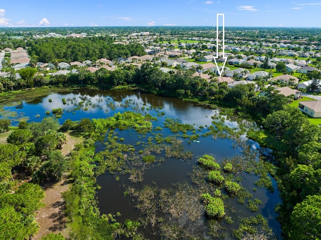 bird's eye view featuring a residential view and a water view