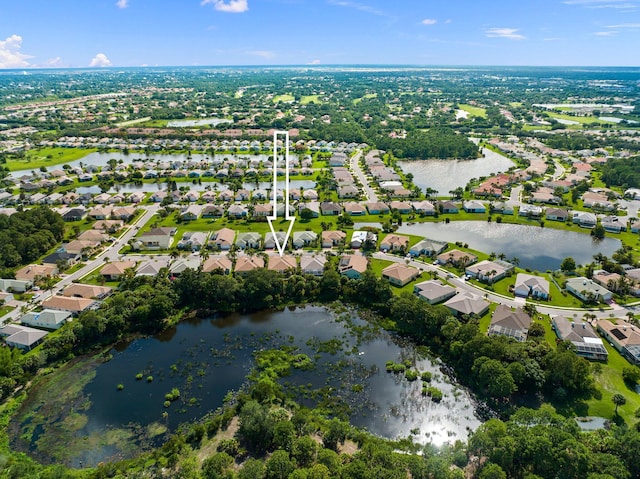 aerial view with a residential view and a water view