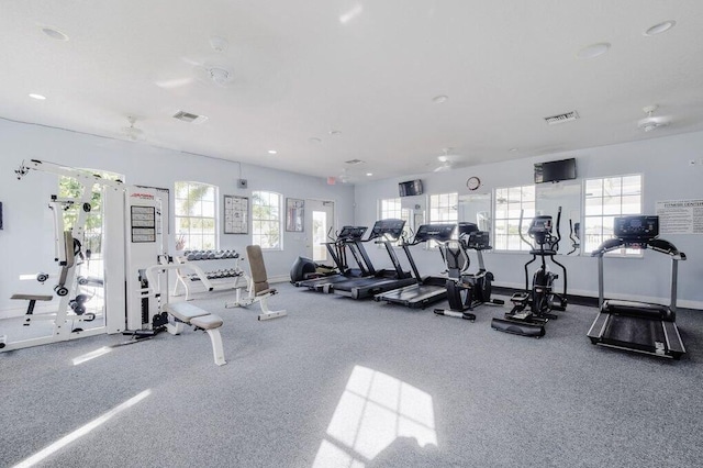 exercise room featuring visible vents and baseboards