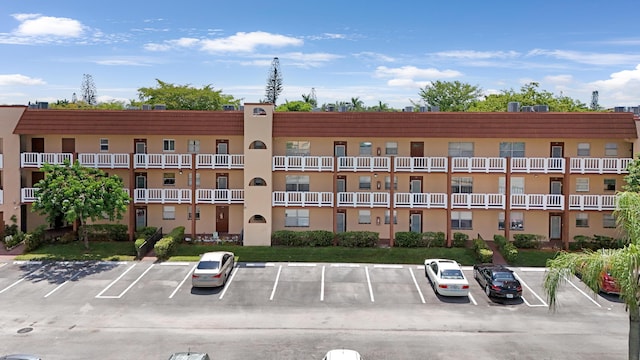 view of property with uncovered parking