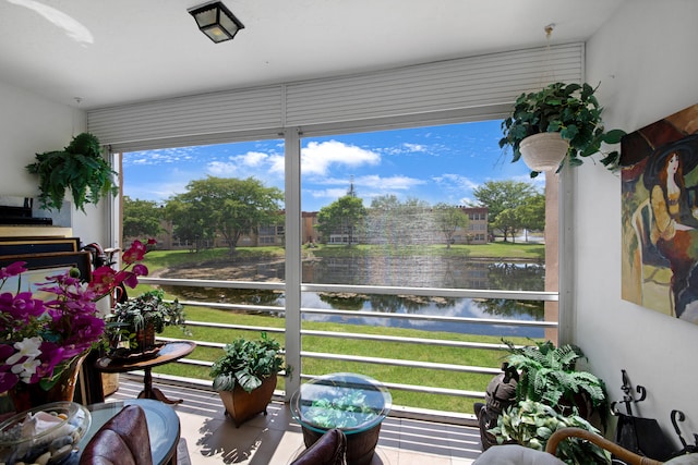 sunroom / solarium with a water view