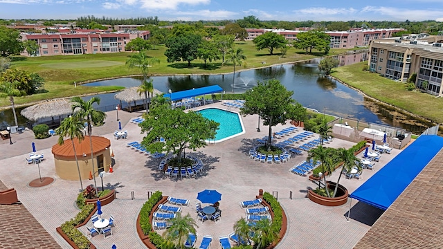 birds eye view of property with a water view